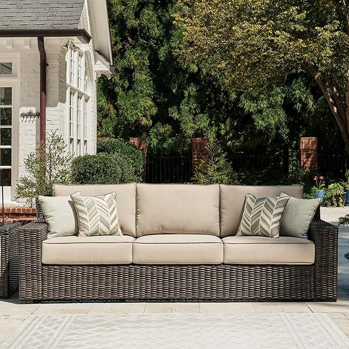 Signature Design by Ashley Coastline Bay Nuvella Weather Resistant Fabric Outdoor Sofa with Cushion and 4 Throw Pillows, Beige & Dark Brown